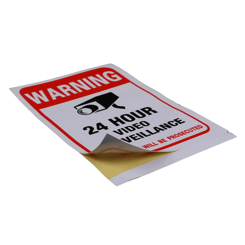 Close up of 24 hour surveillance warning sign showing camera icon