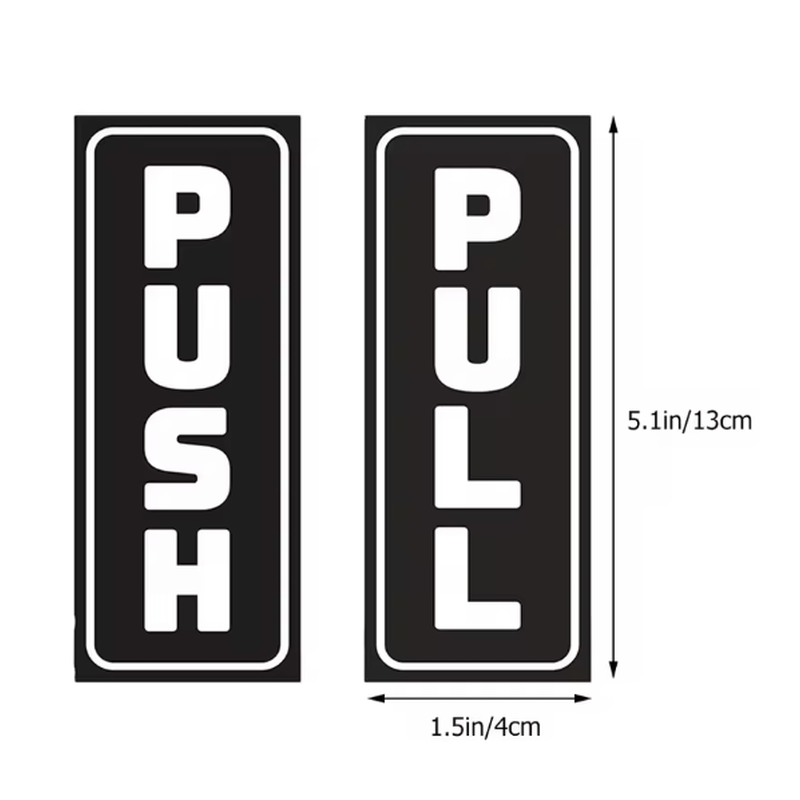 Black push pull door stickers on white door showing clear lettering