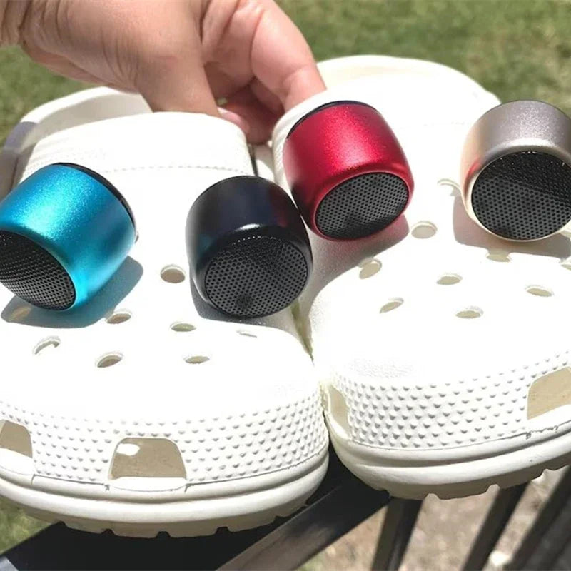 Croc Mini Bluetooth Speaker clipped onto shoe