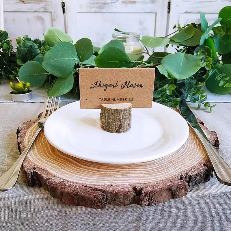 Multiple wooden place card holders arranged on wedding table