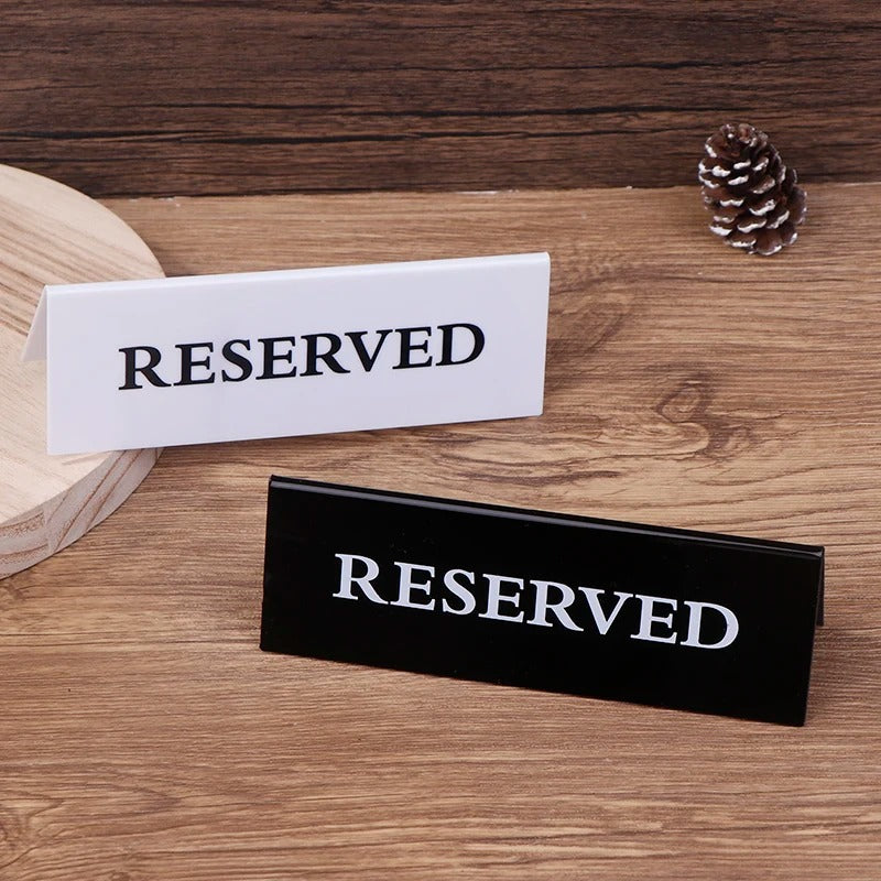 Close-up of premium acrylic reserved table sign