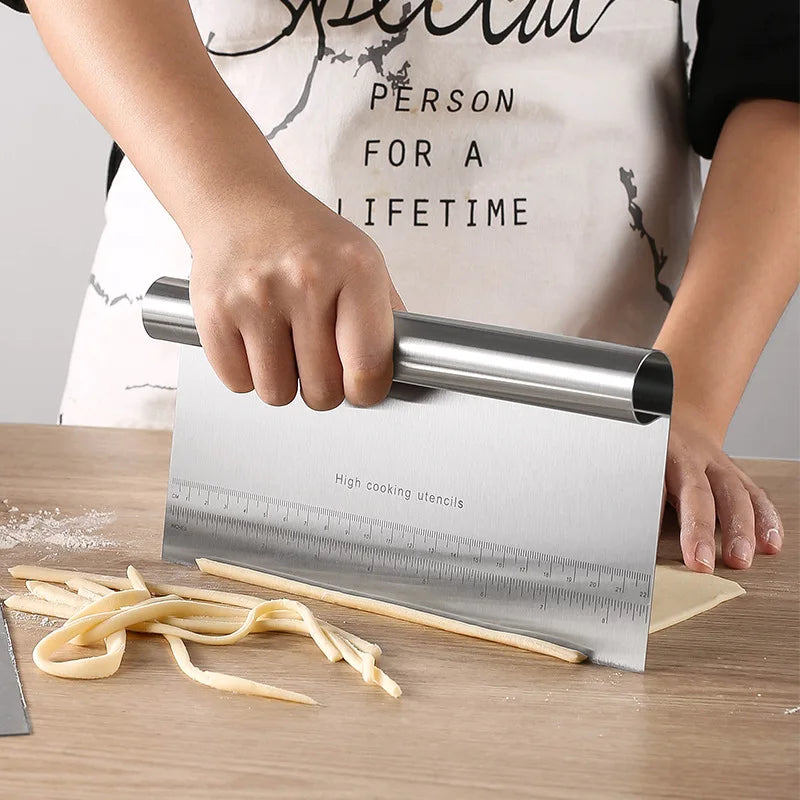 Dough scraper tool being used for pastry preparation